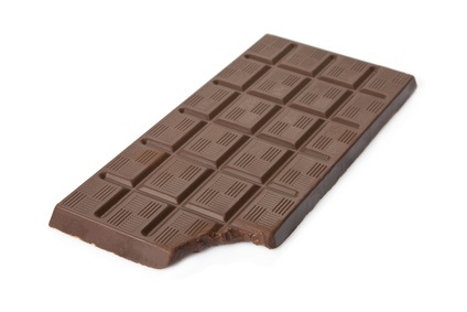 Bitten dark chocolate bar isolated on white background.
